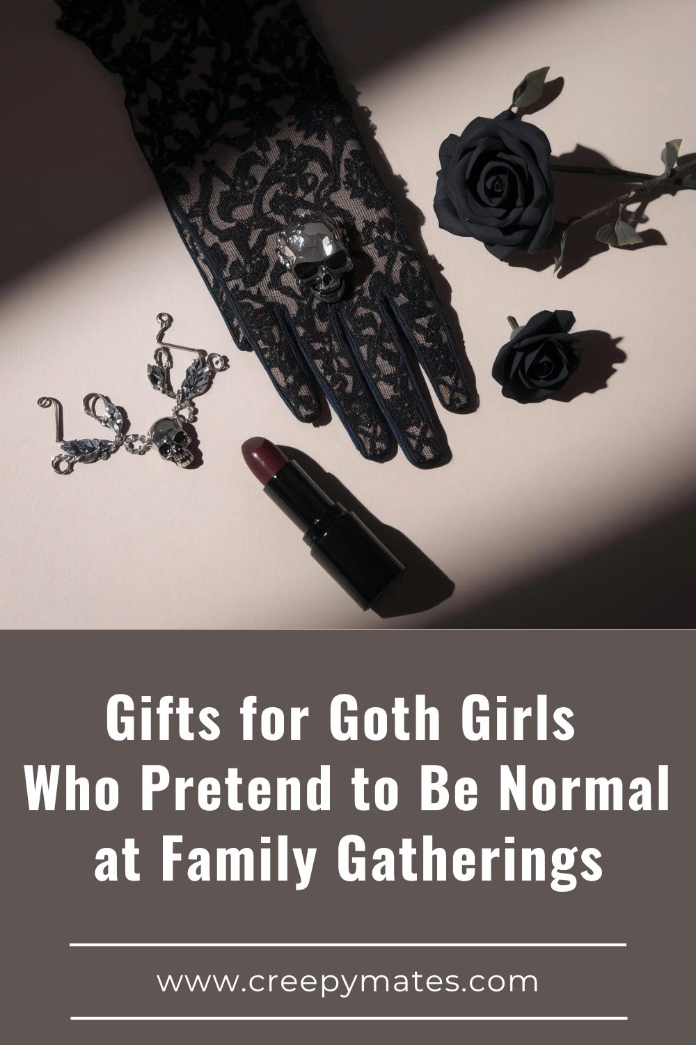 Gothic flat lay with black lace glove and skull ring, black roses, silver skull bracelet, and dark lipstick.