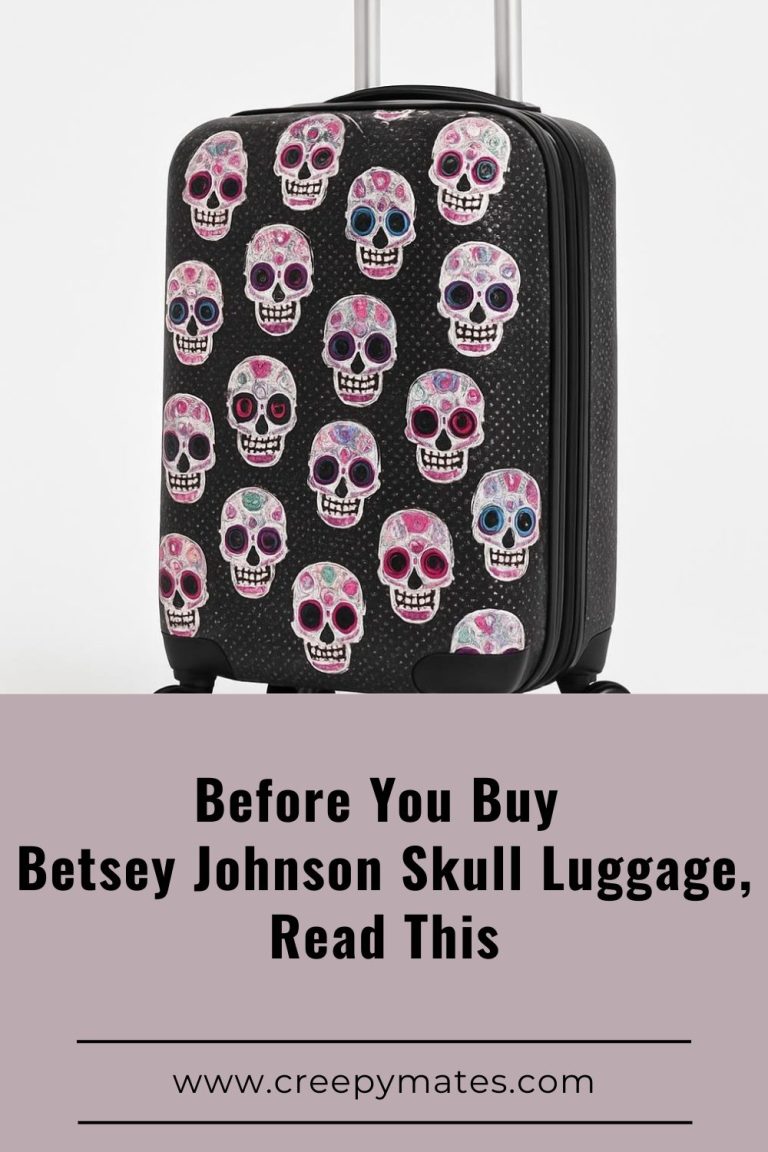 Skull-print carry-on suitcase with colorful skulls on black, studio photo on white.