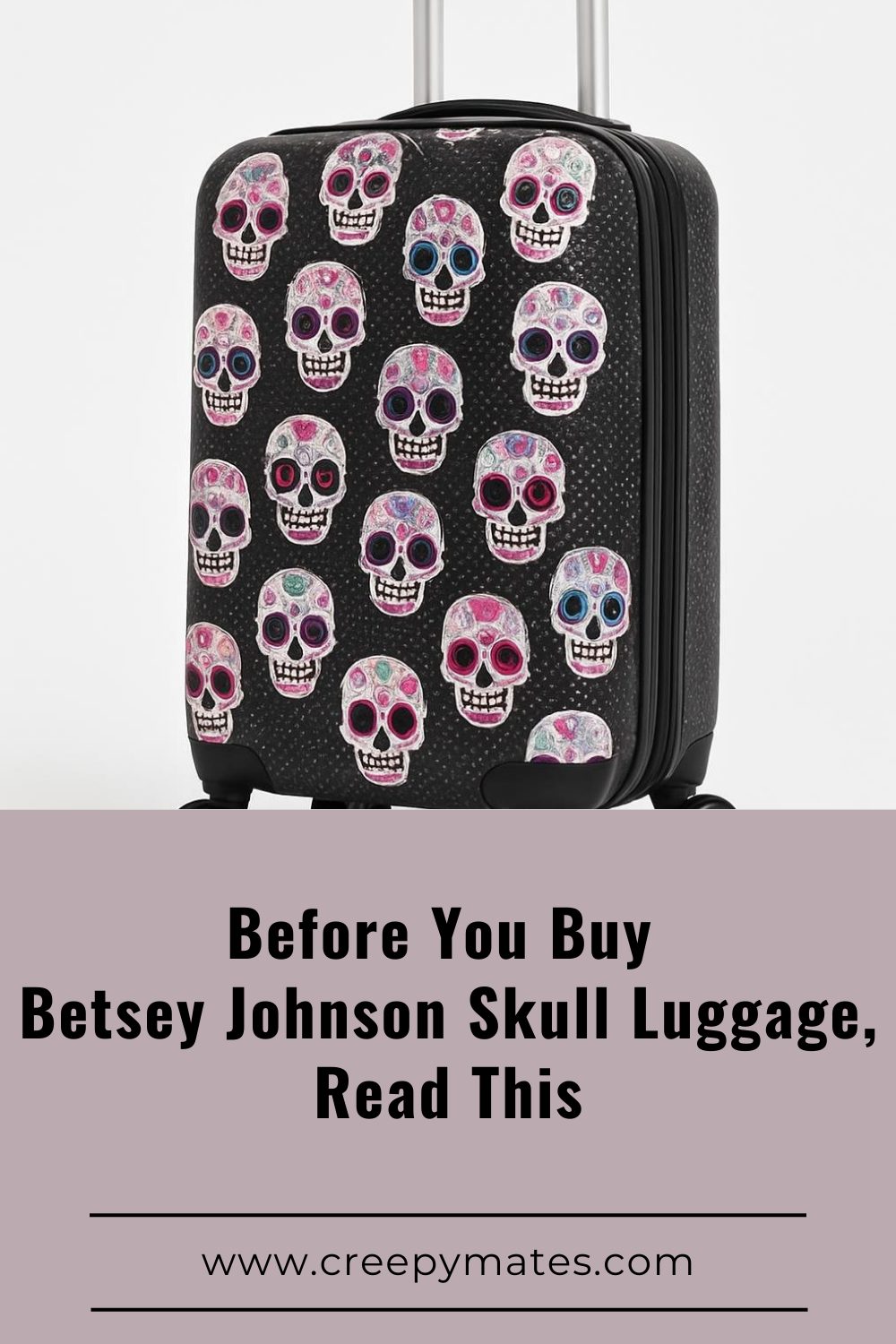 Skull-print carry-on suitcase with colorful skulls on black, studio photo on white.